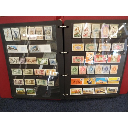 62 - Four stamp albums to include Argentina, Cuba, Dubai, Magyar, Colombia etc