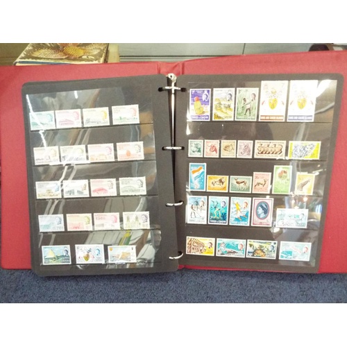 62 - Four stamp albums to include Argentina, Cuba, Dubai, Magyar, Colombia etc