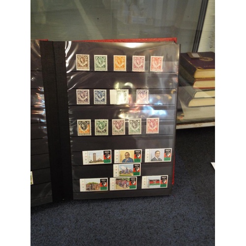 62 - Four stamp albums to include Argentina, Cuba, Dubai, Magyar, Colombia etc