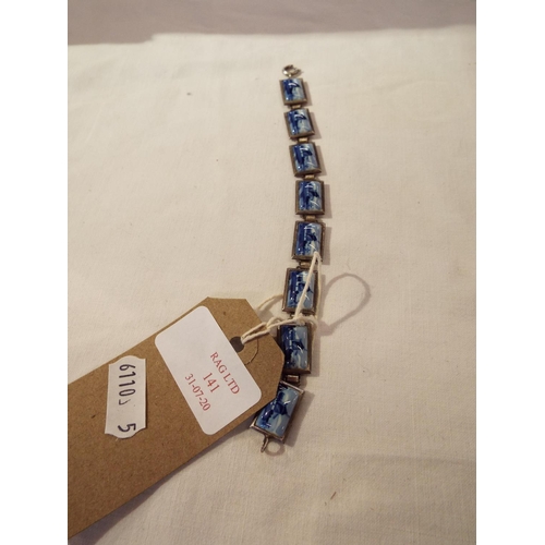141 - A white metal bracelet inset with Delft tiles