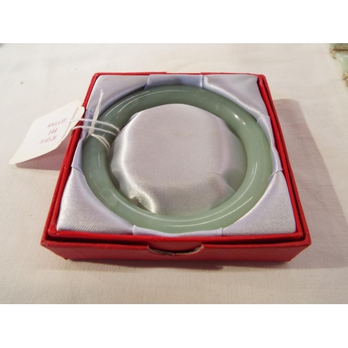 144 - A boxed natural jade cuff bangle