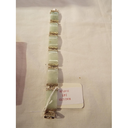 145 - A natural jade in silver bangle
