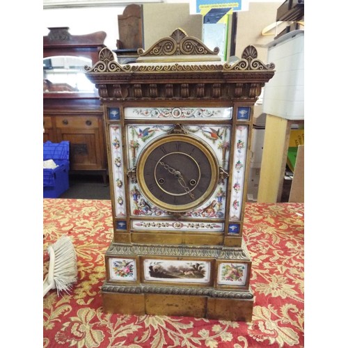 191 - A 19thC Bourdin of Paris gilt bronze mantel clock having porcelain panel decorated with flowers, fru... 