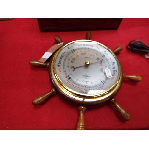 217 - A barometer in the form of a ships wheel