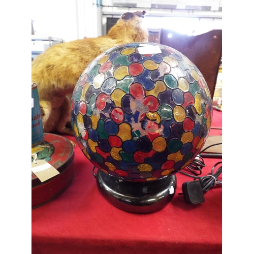 230 - A coloured globed shaped lamp