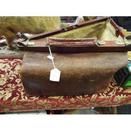 234 - A vintage brown leather Gladstone bag