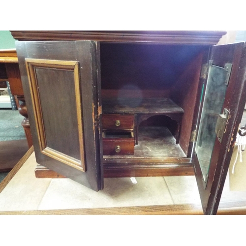 504 - A Victorian ecclesiastical cabinet with inner compartments