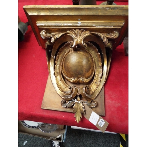 207 - A Victorian gilt gesso wall bracket having ball and scroll decoration