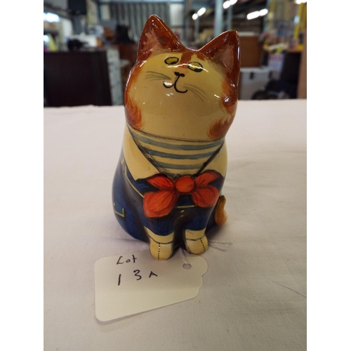 13A - A 1977 Joan & David De Bethel papier-mâché cat with blue coat, signed to base 3.5