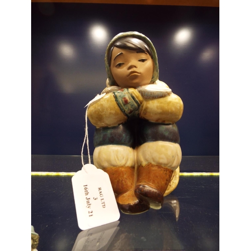 3 - A Lladro Eskimo figurine child seated, signed to base