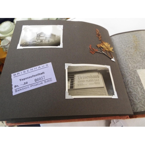 52 - An album containing a quantity of photographs, postcards, tickets etc