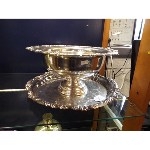 63 - A silver plated punch bowl, together with a silver plated round tray