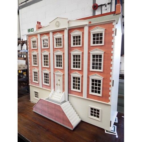 516 - A Victorian dolls house with electrics elaborately furnished, overall measurements 42