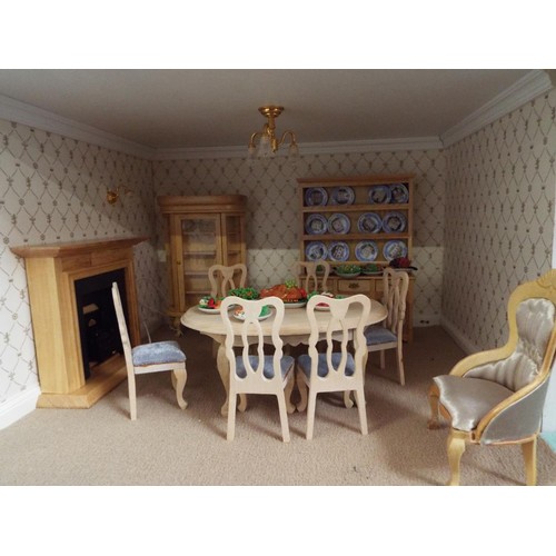 516 - A Victorian dolls house with electrics elaborately furnished, overall measurements 42