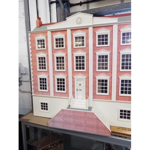 516 - A Victorian dolls house with electrics elaborately furnished, overall measurements 42