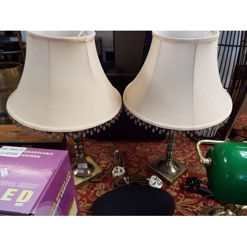 193 - A pair of brushed brass table lamps with shades