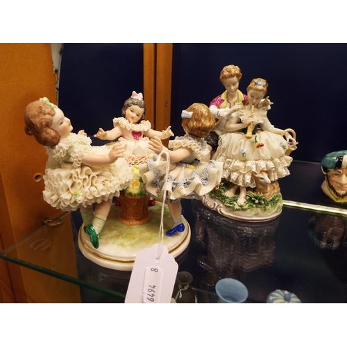 11 - An Unterweissbach of Germany figurine of a courting couple together with another figurine of three c... 