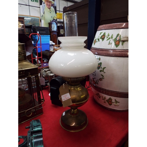 292 - A brass and glass oil lamp