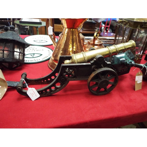 294 - A cast iron and brass cannon