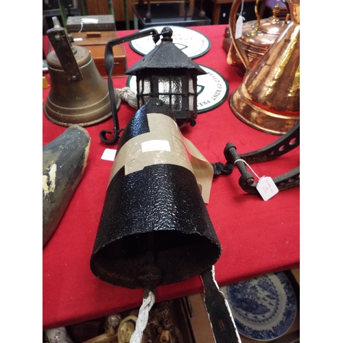 295 - A vintage metal door gong with bracket and a vintage lantern