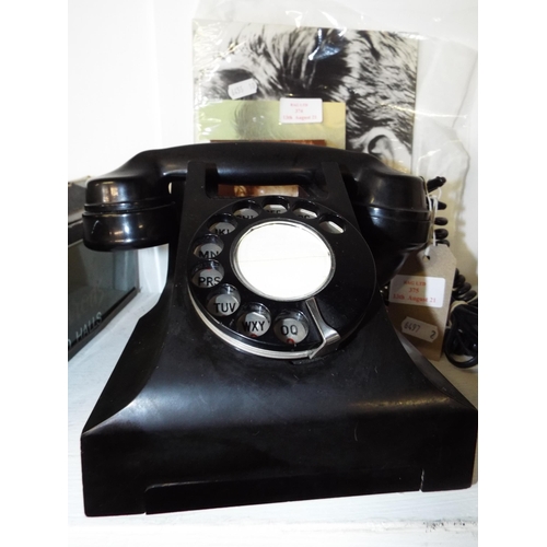 375 - A vintage black Bakelite telephone in working order