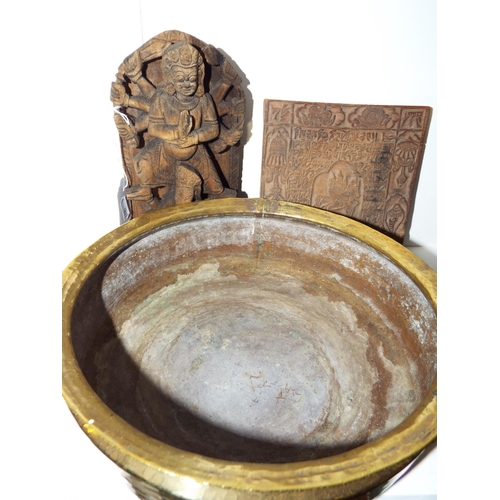 379 - A brass bowl together with two wooden wall hangings, one depicting an Indian God