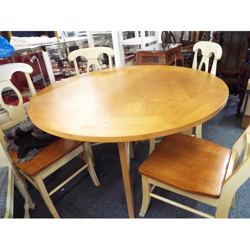 723 - A Habitat beech circular dining table and four cream painted chairs