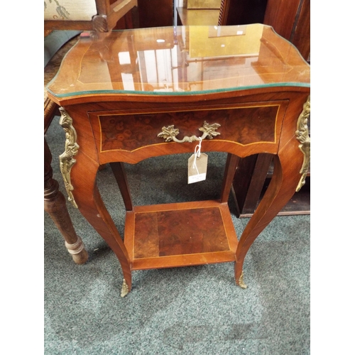 730 - A Louis XVI style side table having ormolu decoration frieze drawer resting on shaped supports