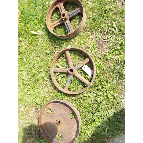 523 - Three vintage cast iron trolley wheels