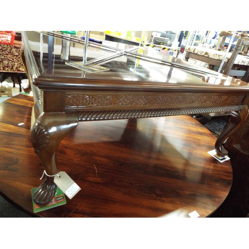 717 - A large Chinese style square top coffee table resting on short cabriole legs
