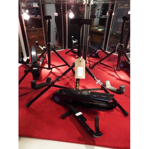 112 - A Fender short guitar stand and conductor instrument stand