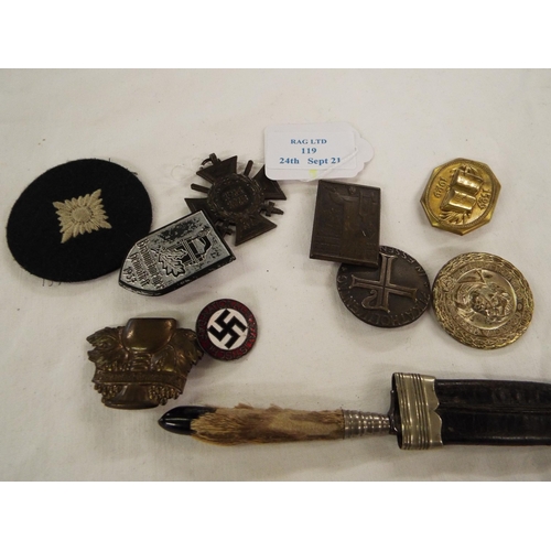 119 - A selection of WWII military badges and insignia and ornamental knife