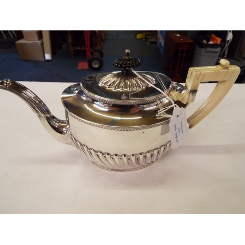 129 - A Sheffield 1897 tea-pot having fluted decoration, bone handle and ebony finial