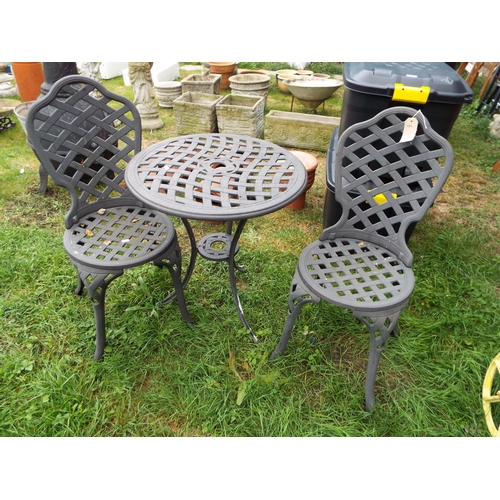 156 - A cast aluminium garden table and two matching chairs