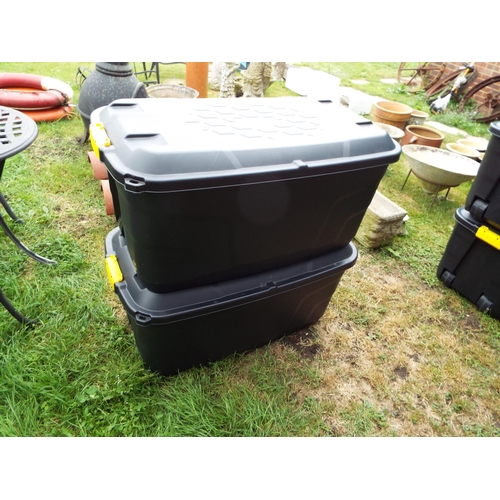 157 - A pair of heavy duty plastic storage boxes with lids and four wheels, 145 litres