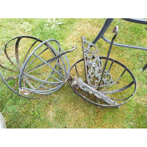 164 - Three cast iron hanging baskets and a pair of brackets