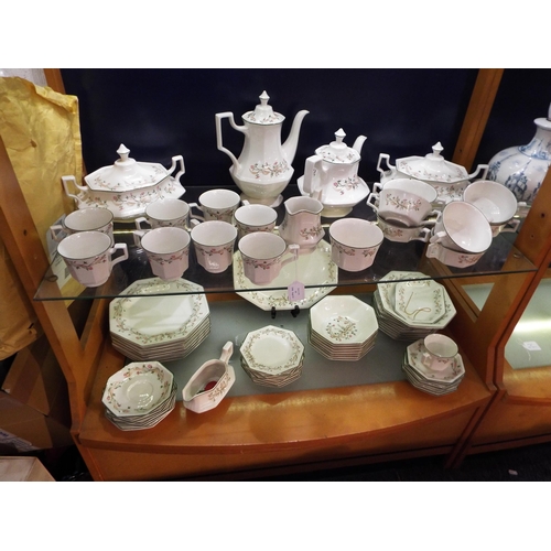 64 - A large selection of Johnson Brothers 'Eternal Beau' dinner and tea ware to include plates, cups, sa... 