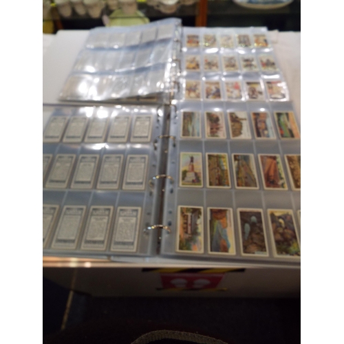 67 - Two albums housing cigarette cards to include 'Shots from Famous Films', 'Speed', 'Flags of the Leag... 
