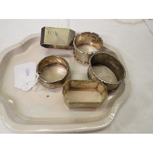 135A - A pair of Birmingham silver napkin ring with engine turned decoration and three others 6oz