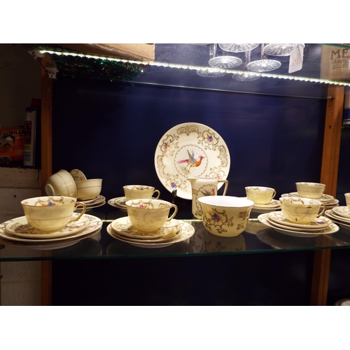 56 - A Victorian porcelain part tea set with bird and floral decoration A/F