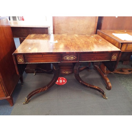 327 - A late Regency rosewood sofa table with rounded drop leafs over two frieze drawers with gilt brass m... 