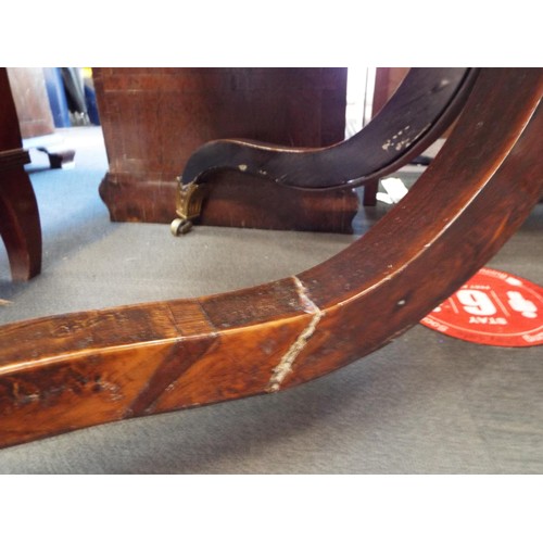 327 - A late Regency rosewood sofa table with rounded drop leafs over two frieze drawers with gilt brass m... 