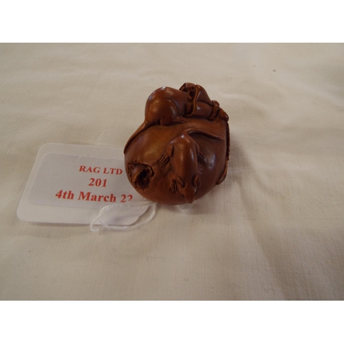 201 - A hand carved boxwood netsuke sack with rats, signed