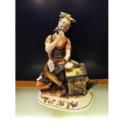 74 - A large Capodimonte figurine Cobbler