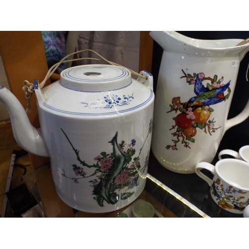 99 - A large oriental teapot and water jug