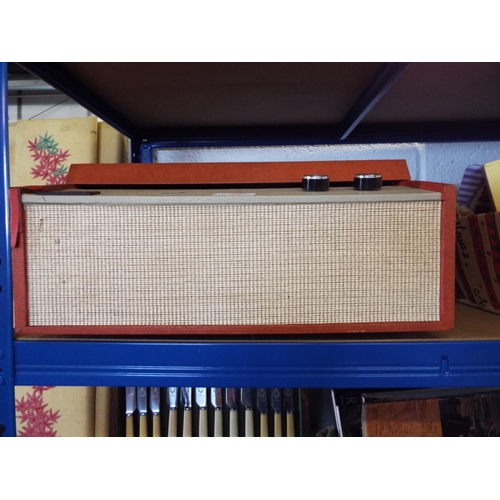 388 - A vintage Tellux record player in red colourway