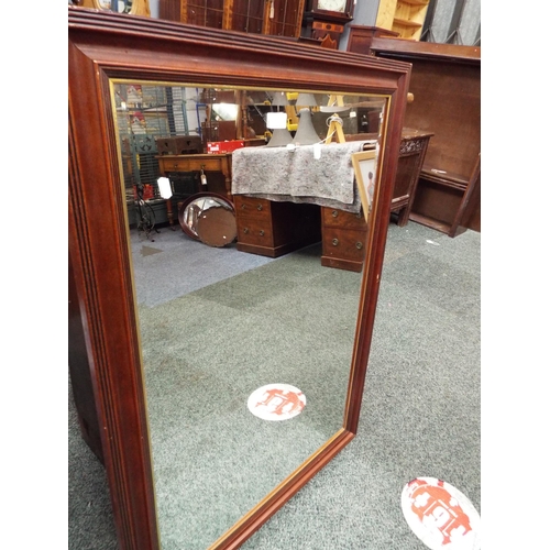 725 - A mahogany framed bevel glass mirror