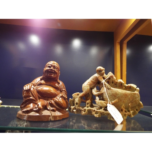 22 - A wooden Buddha together with a soapstone carving of a monkey and birds