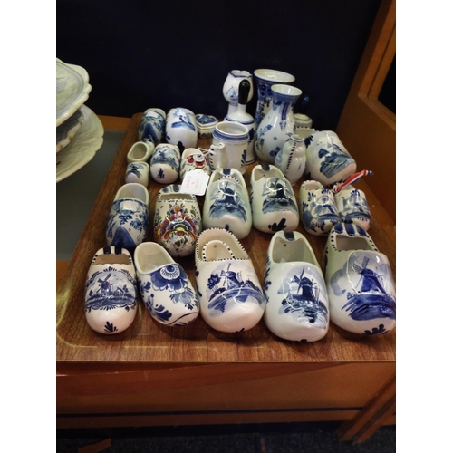 70 - A mixed selection of assorted Delft ware to include bells, vases, clogs etc