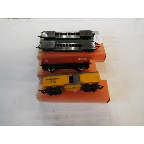 164 - A Tri-ang Railways AM box bogie car, a Hornby 235 private LMB 'Railfreight' open wagon, a Tri-ang WD... 